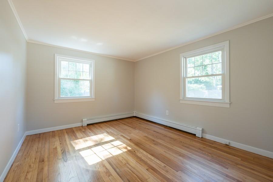 343 Strawberry Hill Road Centerville, MA 02632 - Photo 10 of 15 a view of empty room with wooden floor and fan