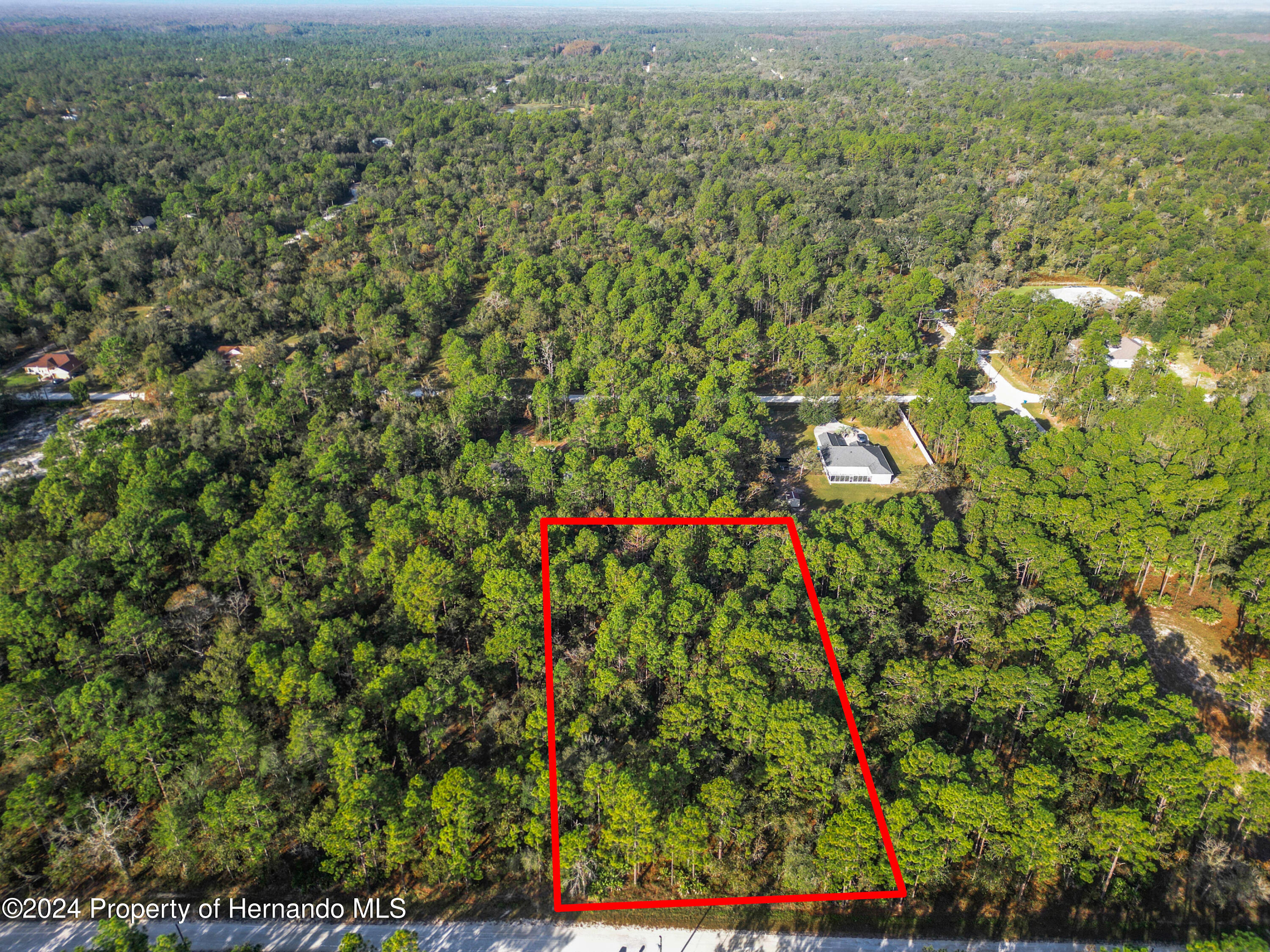 0 Macek Weeki Wachee, FL 34614 - Photo 3 of 22 an aerial view of residential houses with outdoor space and trees