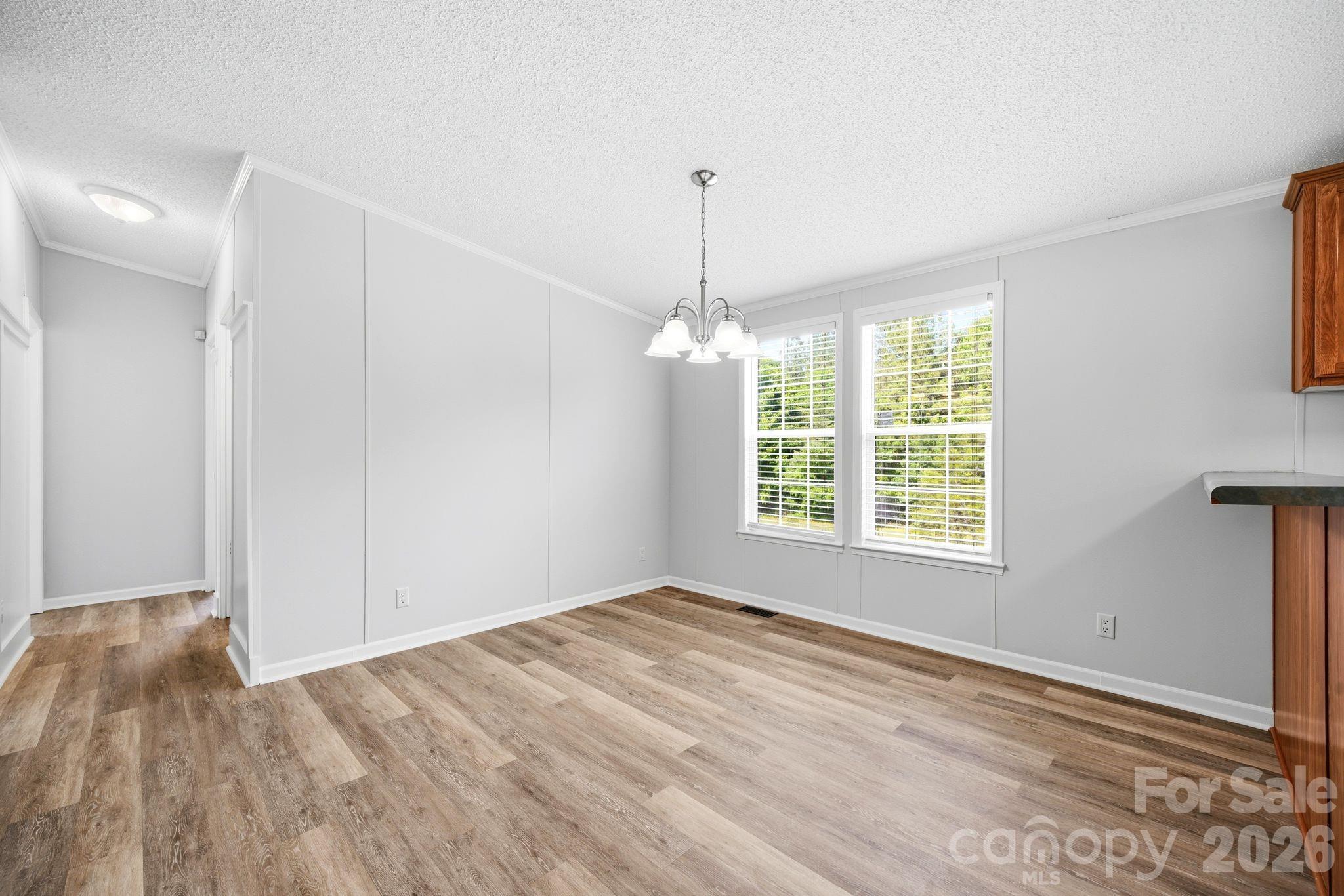 2368 Beth Haven Church Road Denver, NC 28037 - Photo 12 of 42 a view of empty room with wooden floor and fan