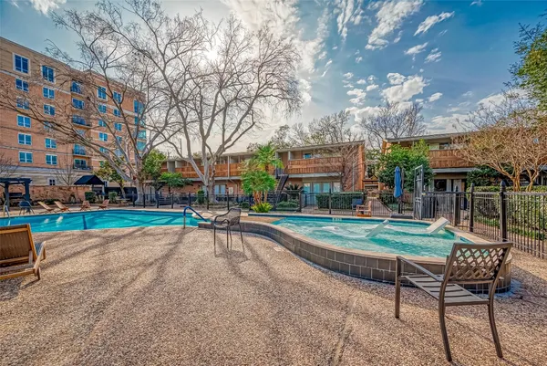 a view of swimming pool with outdoor seating