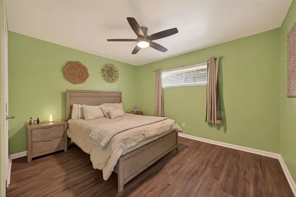 a bedroom with a bed and window