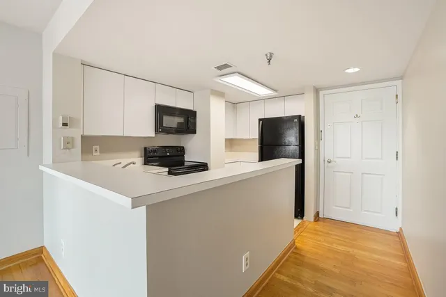 a kitchen with stainless steel appliances a refrigerator and sink