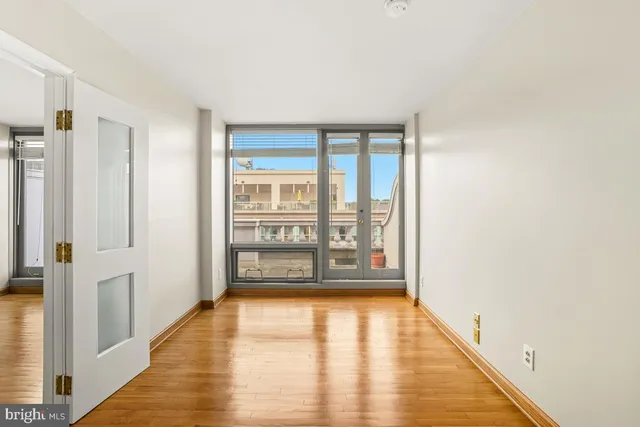 a view of an empty room with a window