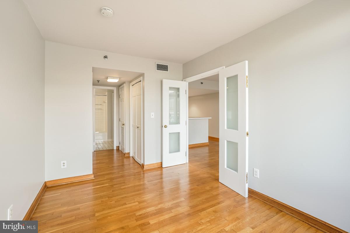 801 Pennsylvania Avenue Northwest, Unit PH06 Washington, DC 20004 - Photo 22 of 38 a view of wooden floor in an empty room