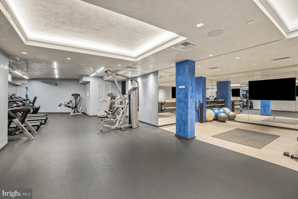 801 Pennsylvania Avenue Northwest, Unit PH06 Washington, DC 20004 - Photo 30 of 38 a view of a room with gym equipment