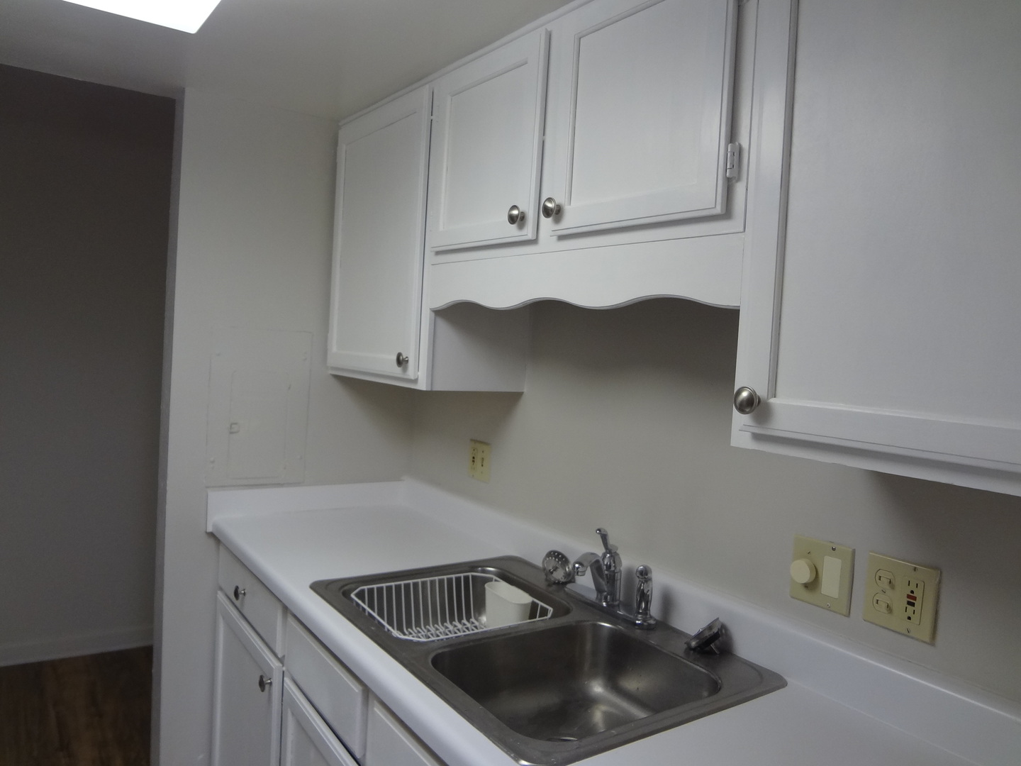 1 Renaissance Place, Unit 905 Palatine, IL 60067 - Photo 11 of 21 a kitchen with a sink and cabinets