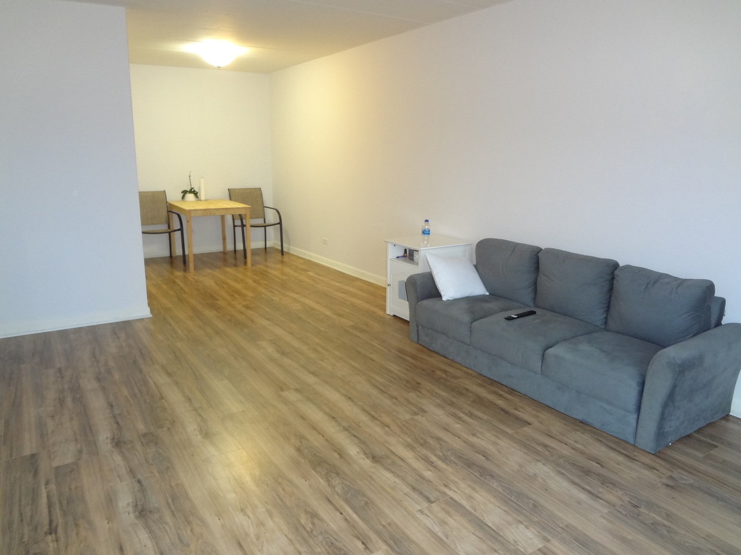 1 Renaissance Place, Unit 905 Palatine, IL 60067 - Photo 13 of 21 a living room with furniture and a wooden floor