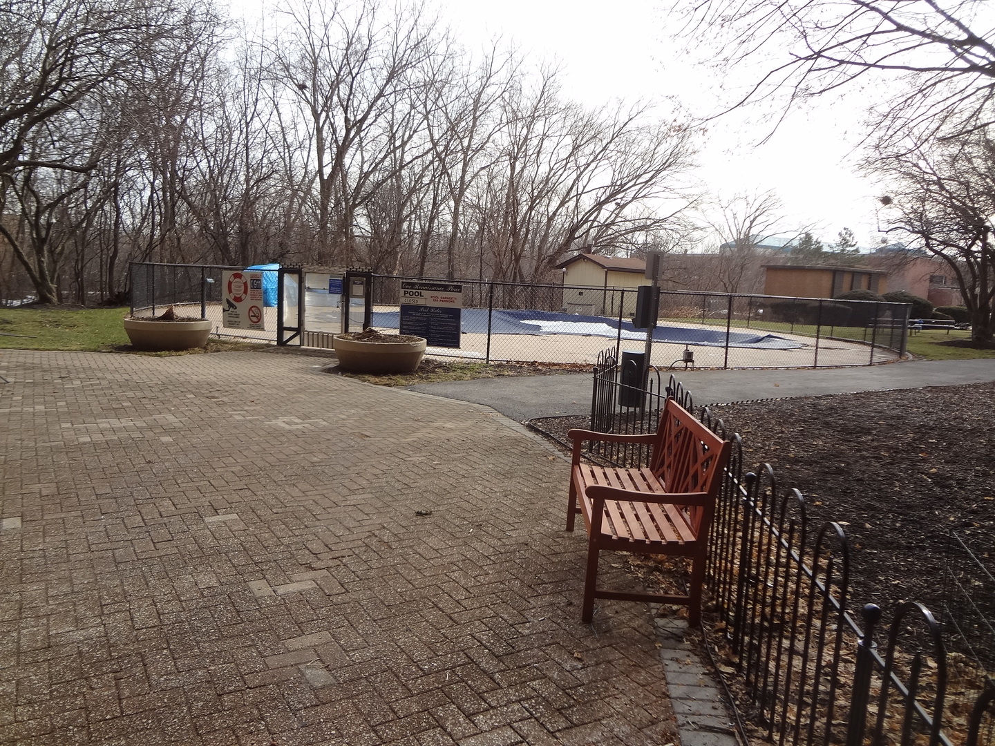 1 Renaissance Place, Unit 905 Palatine, IL 60067 - Photo 21 of 21 a view of a patio with table and chairs and wooden fence