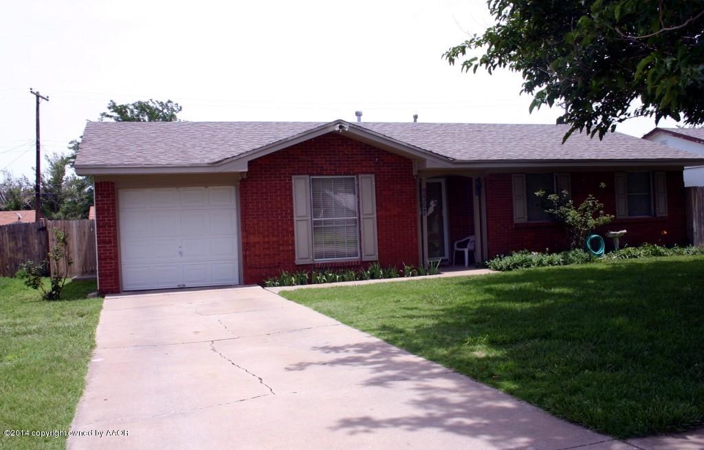 5307 Allen Street Amarillo, TX 79110 - Photo 3 of 35 a front view of a house with a garden