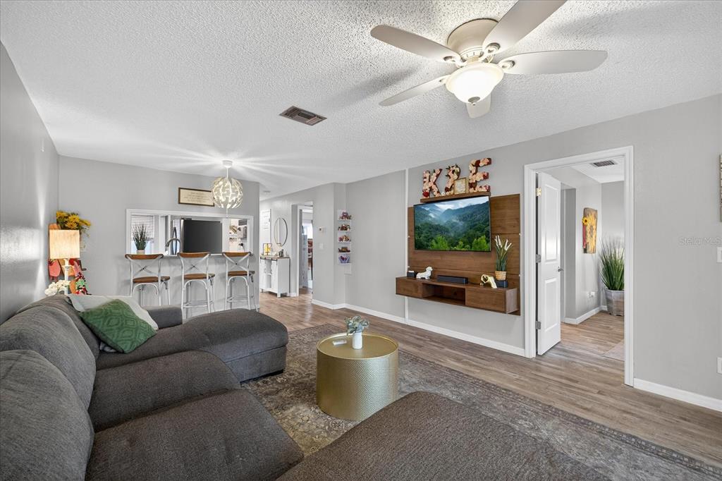 3230 Teeside Drive New Port Richey, FL 34655 - Photo 11 of 32 a living room with furniture and a flat screen tv