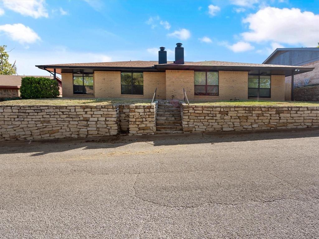 1117 South Rusk Street, Unit 1117 Weatherford, TX 76086 - Photo 2 of 16 front view of a house with a street