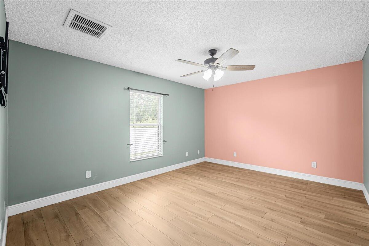 6445 Ainsworth Road Cocoa, FL 32927 - Photo 20 of 31 a view of an empty room with a window