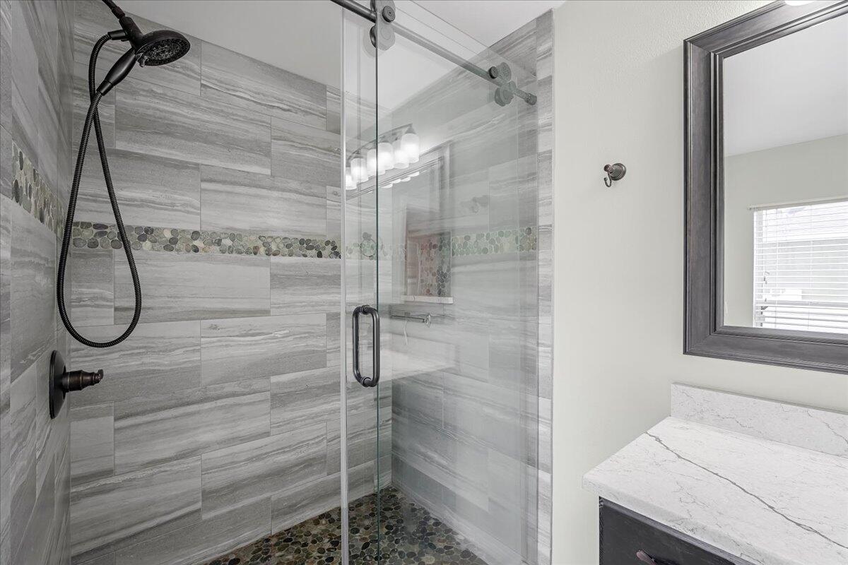 6445 Ainsworth Road Cocoa, FL 32927 - Photo 23 of 31 a bathroom with a shower