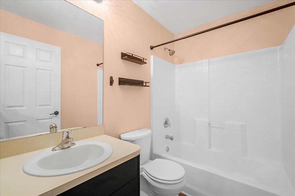 6445 Ainsworth Road Cocoa, FL 32927 - Photo 25 of 31 a bathroom with a sink toilet and shower