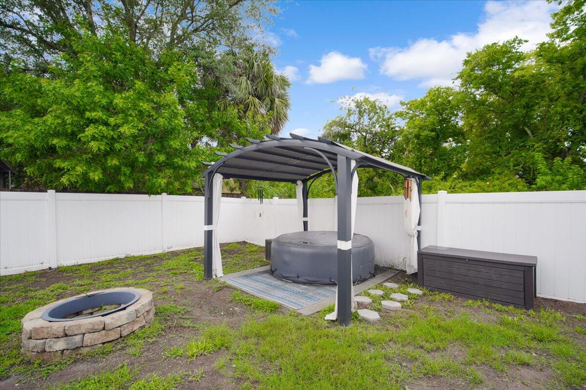 6445 Ainsworth Road Cocoa, FL 32927 - Photo 29 of 31 a backyard of a house with table and chairs
