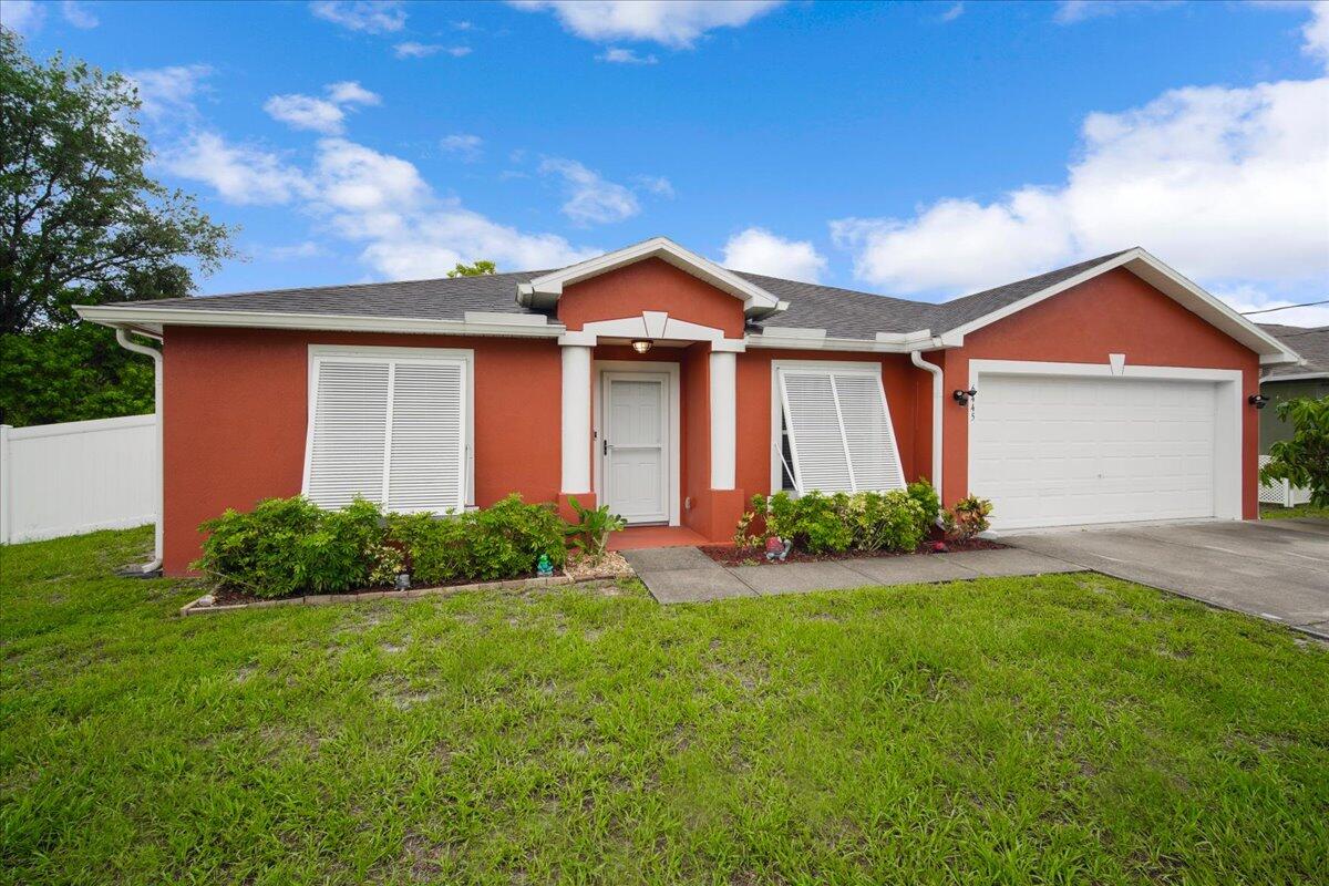6445 Ainsworth Road Cocoa, FL 32927 - Photo 4 of 31 a front view of a house with yard and green space