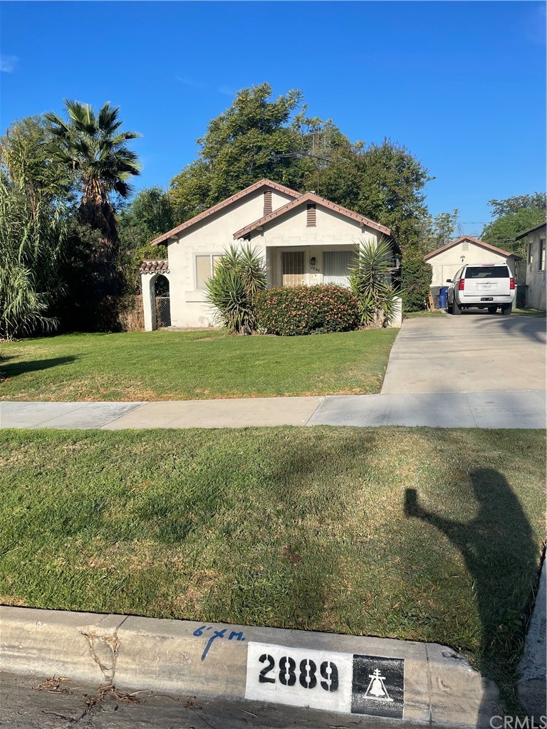 2889 Lime Street Riverside, CA 92501 - Photo 1 of 1 a view of a house with a yard