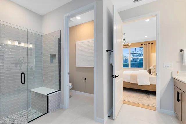 a bathroom with a bathtub and shower