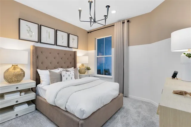 a spacious bedroom with a bed and a dresser