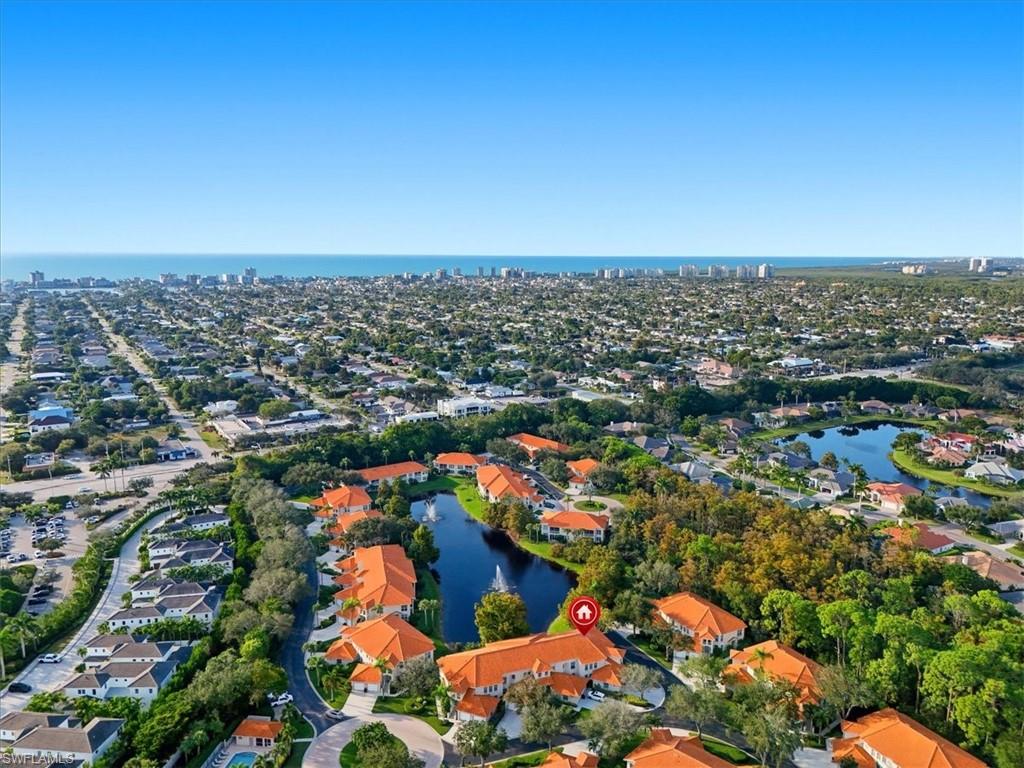 1109 Egrets Walk Circle, Unit 104 Naples, FL 34108 - Photo 17 of 17 an aerial view of a city