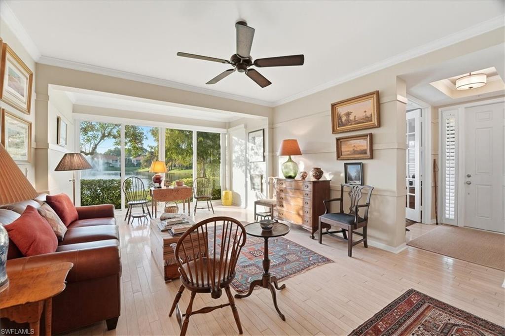 1109 Egrets Walk Circle, Unit 104 Naples, FL 34108 - Photo 3 of 17 a work room with furniture and a large window