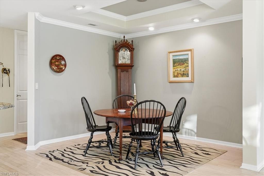 1109 Egrets Walk Circle, Unit 104 Naples, FL 34108 - Photo 4 of 17 a view of a dining room and livingroom