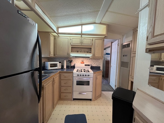 2795 East 28th Road Marseilles, IL 61341 - Photo 12 of 58 a kitchen with stainless steel appliances a refrigerator and a stove