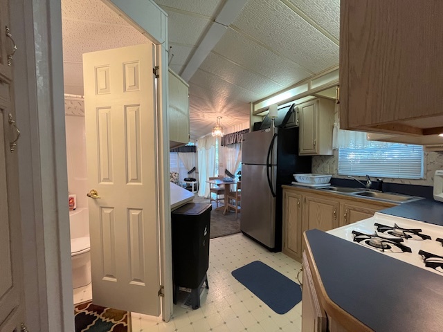 2795 East 28th Road Marseilles, IL 61341 - Photo 16 of 58 a kitchen with refrigerator and chairs