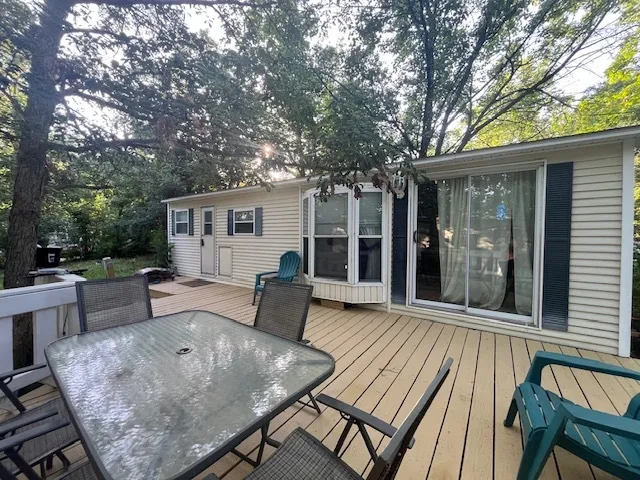 a bedroom with bed and a window