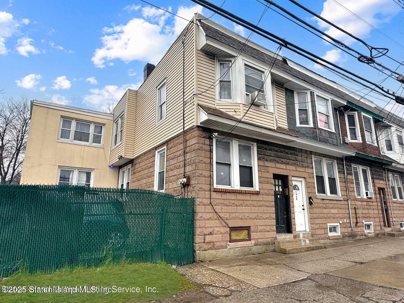 1418 Castleton Avenue Staten Island, NY 10302 - Photo 2 of 3 a view of a house with a garden