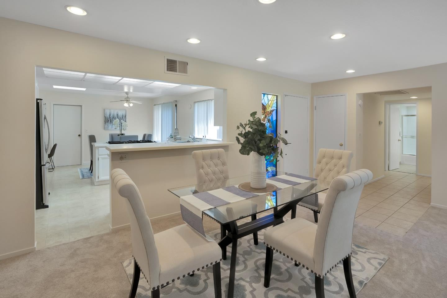 6294 Blauer Lane San Jose, CA 95135 - Photo 11 of 26 a view of a dining room with furniture and a chandelier