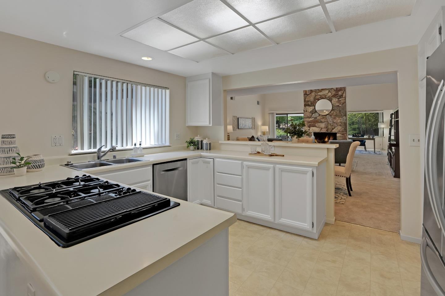 6294 Blauer Lane San Jose, CA 95135 - Photo 12 of 26 a kitchen with a stove a sink and a refrigerator