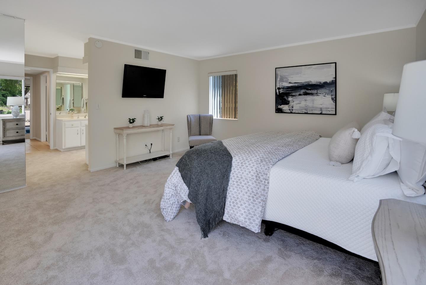 6294 Blauer Lane San Jose, CA 95135 - Photo 16 of 26 a bedroom with a bed and a flat screen tv