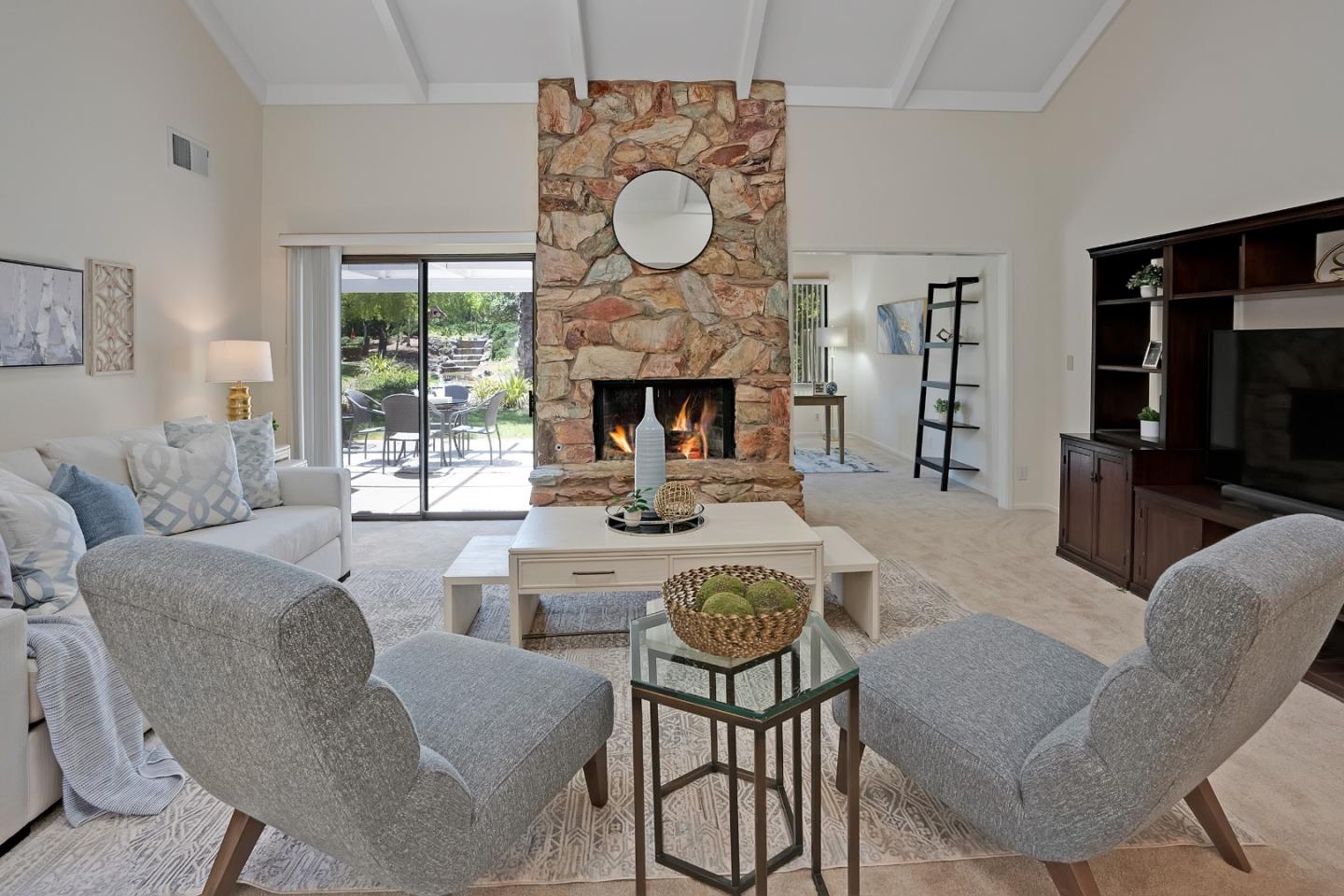 6294 Blauer Lane San Jose, CA 95135 - Photo 6 of 26 a living room with furniture a fireplace and a flat screen tv