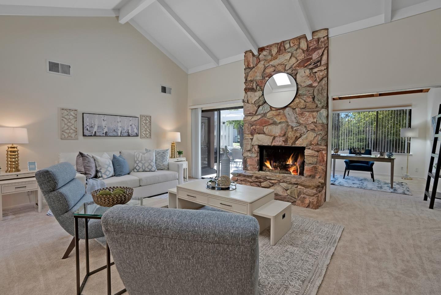 6294 Blauer Lane San Jose, CA 95135 - Photo 7 of 26 a living room with furniture a fireplace and a large window