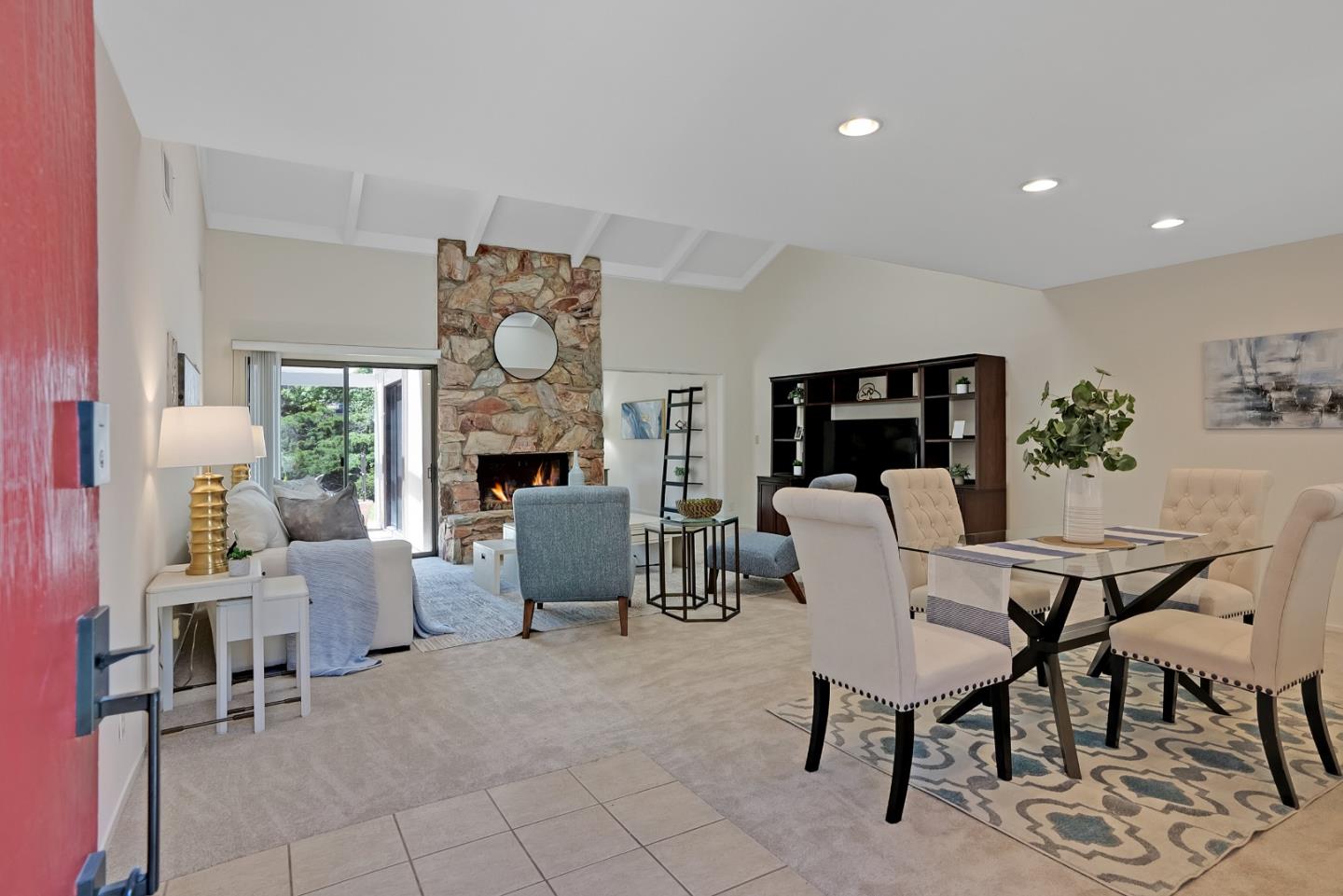 6294 Blauer Lane San Jose, CA 95135 - Photo 9 of 26 a dining room with furniture a fireplace and a chandelier