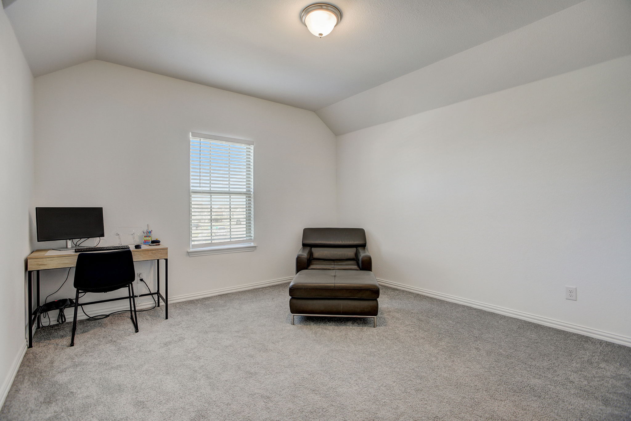 308 Monteforte Road Hutto, TX 78634 - Photo 18 of 32 a living room with furniture and a flat screen tv