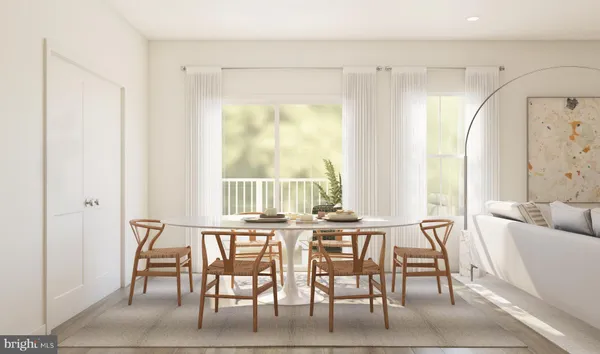 a view of a dining room with furniture and a window