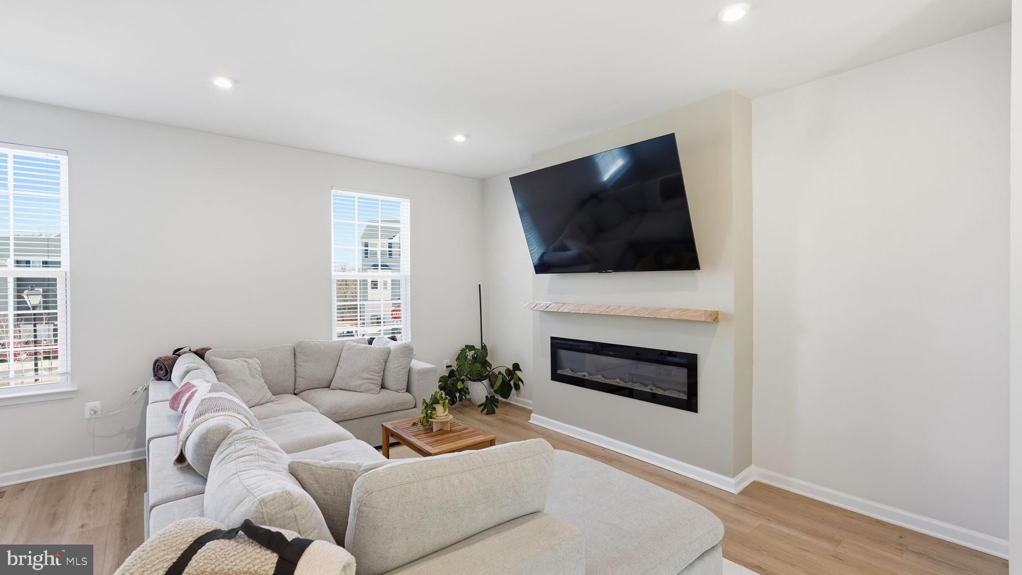 1790 Scenic Loop Culpeper, VA 22701 - Photo 12 of 33 a living room with furniture a fireplace and a flat screen tv