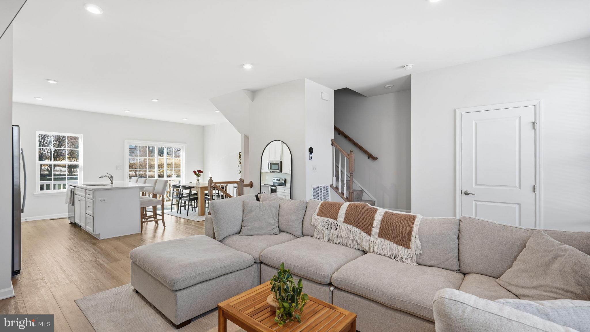 1790 Scenic Loop Culpeper, VA 22701 - Photo 13 of 33 a living room with furniture white walls and wooden floor