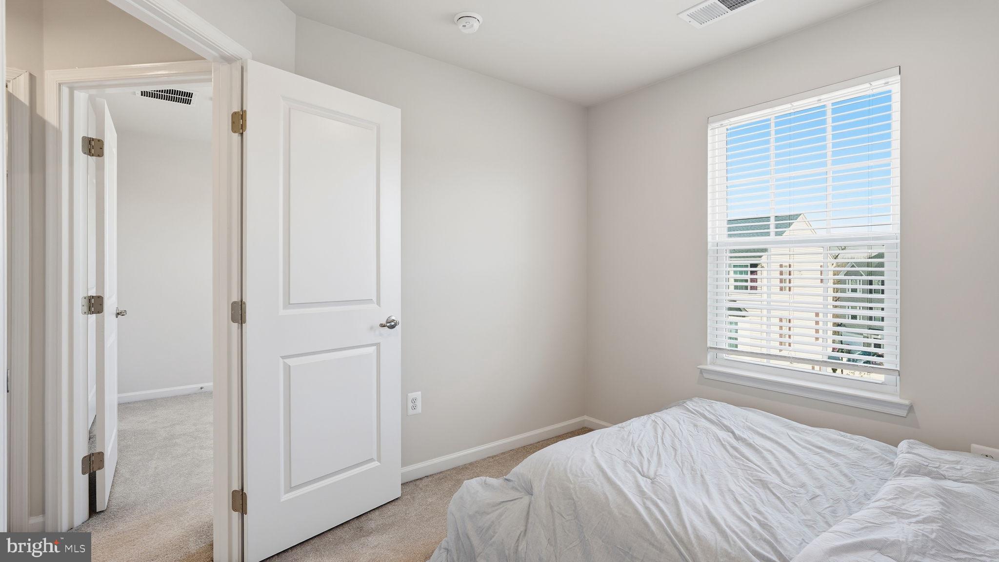 1790 Scenic Loop Culpeper, VA 22701 - Photo 22 of 33 a bedroom with a bed and a window