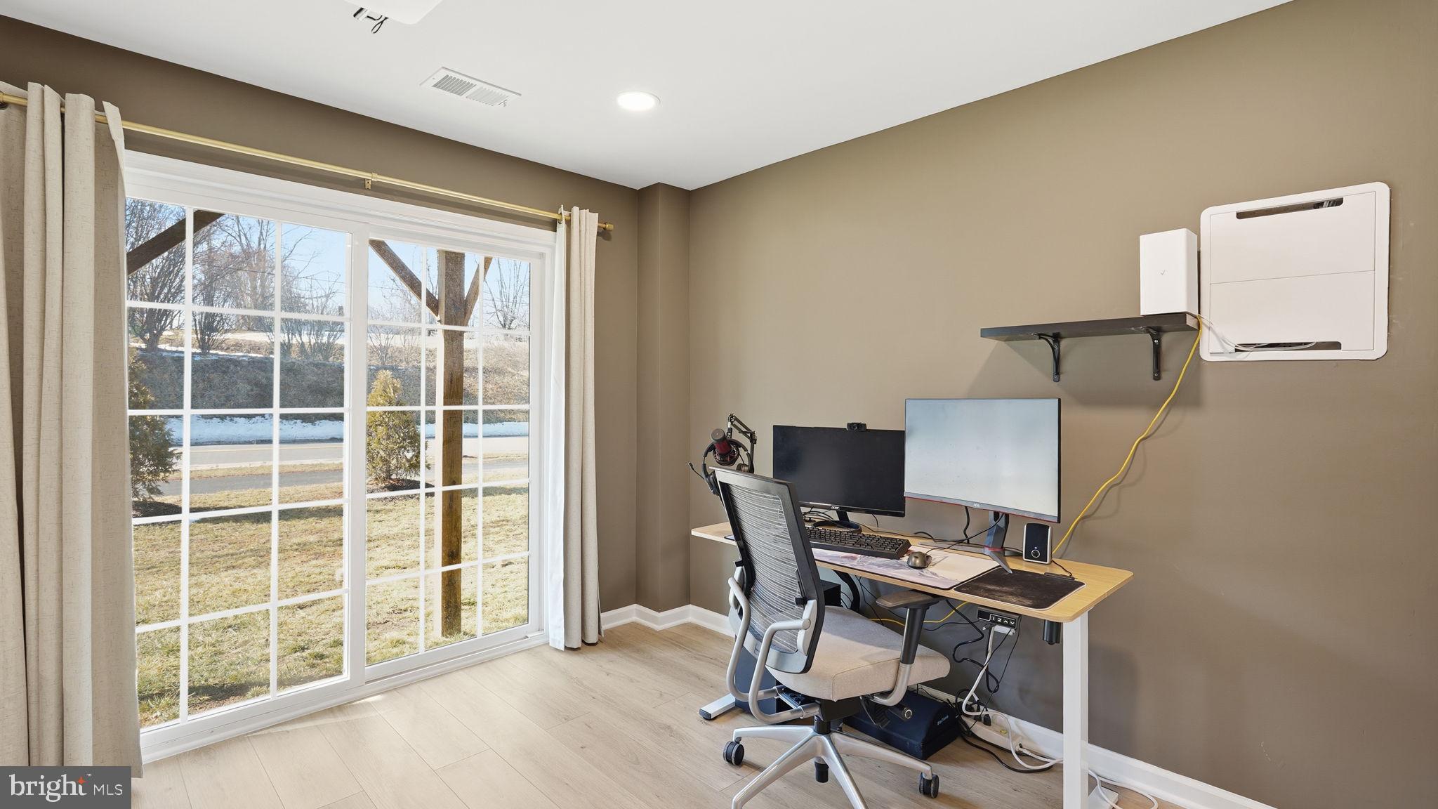 1790 Scenic Loop Culpeper, VA 22701 - Photo 28 of 33 a view of a workspace with furniture and a window