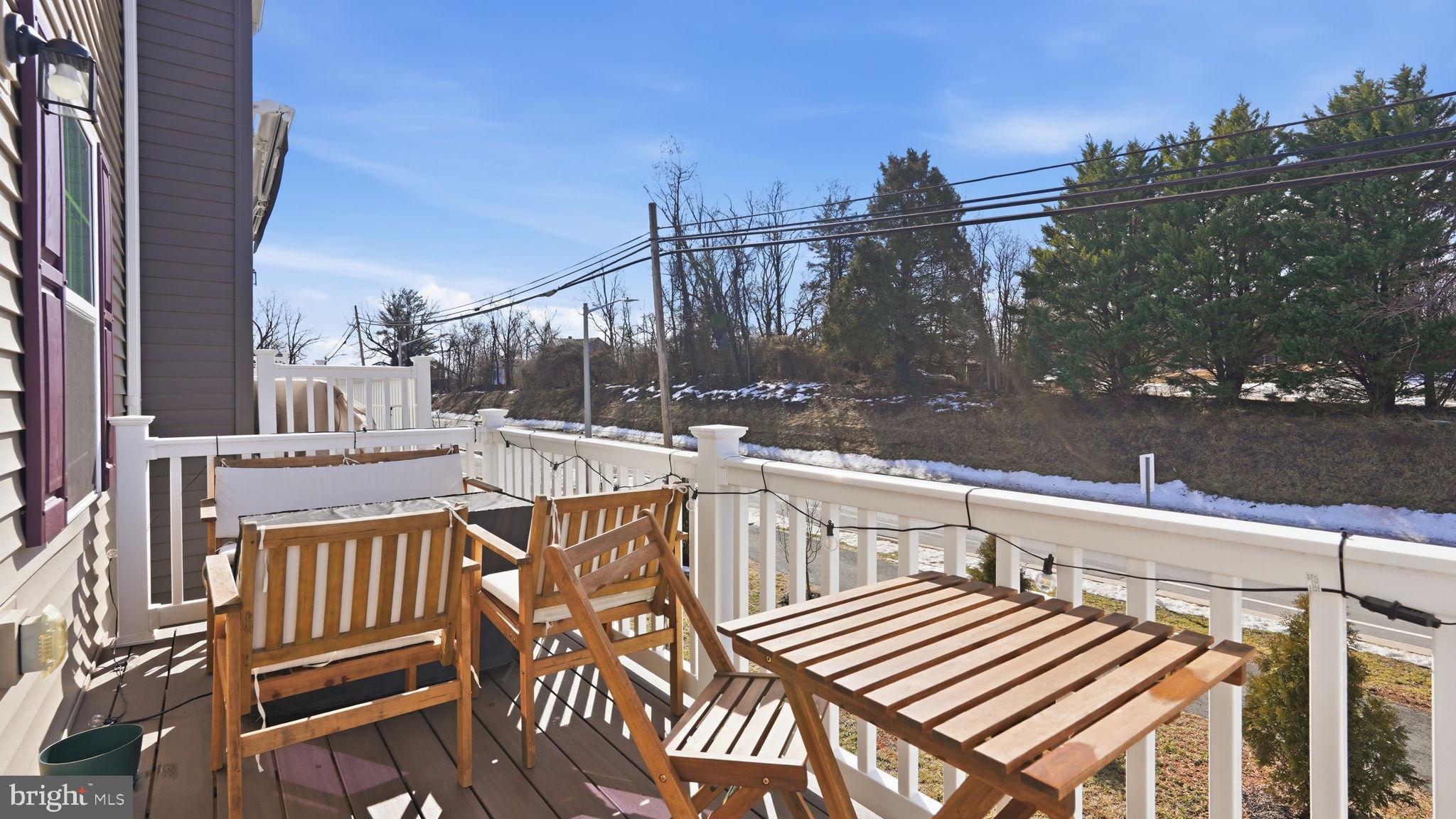 1790 Scenic Loop Culpeper, VA 22701 - Photo 31 of 33 a view of a balcony with wooden floor and outdoor seating