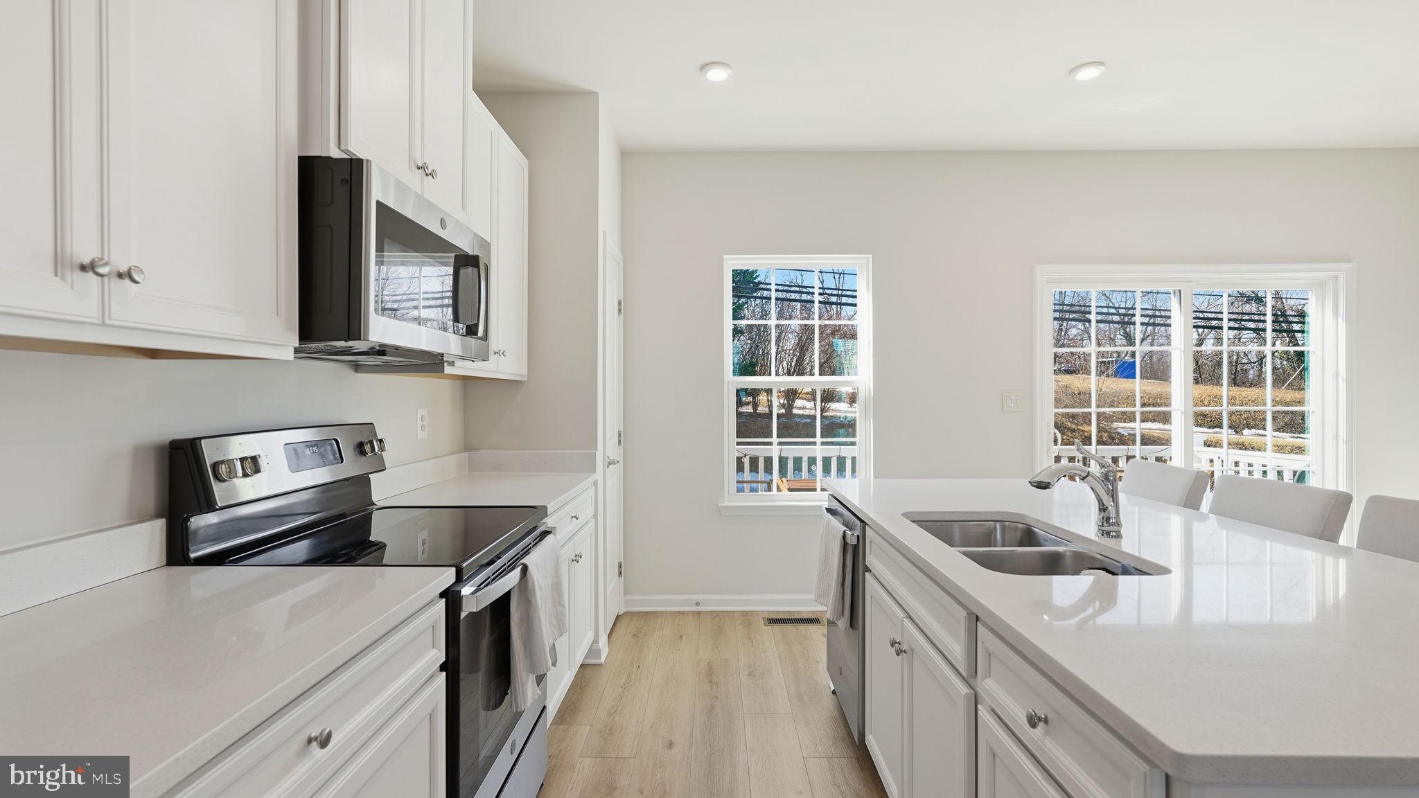 1790 Scenic Loop Culpeper, VA 22701 - Photo 5 of 33 a kitchen that has a sink and a stove