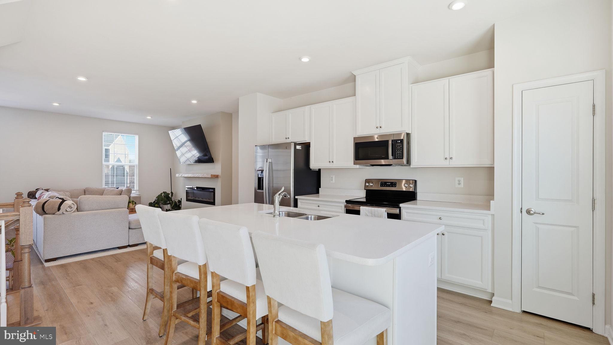 1790 Scenic Loop Culpeper, VA 22701 - Photo 7 of 33 a kitchen with a sink stainless steel appliances and white cabinets