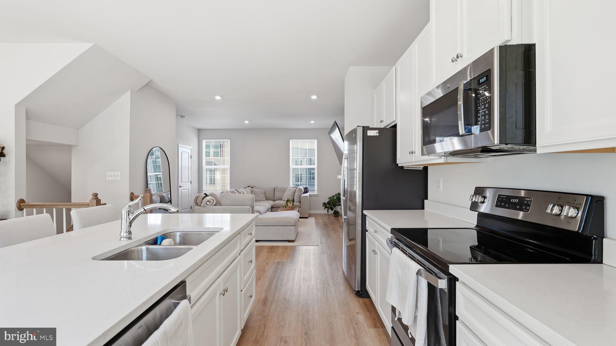 1790 Scenic Loop Culpeper, VA 22701 - Photo 8 of 33 a kitchen with stainless steel appliances a sink stove and refrigerator
