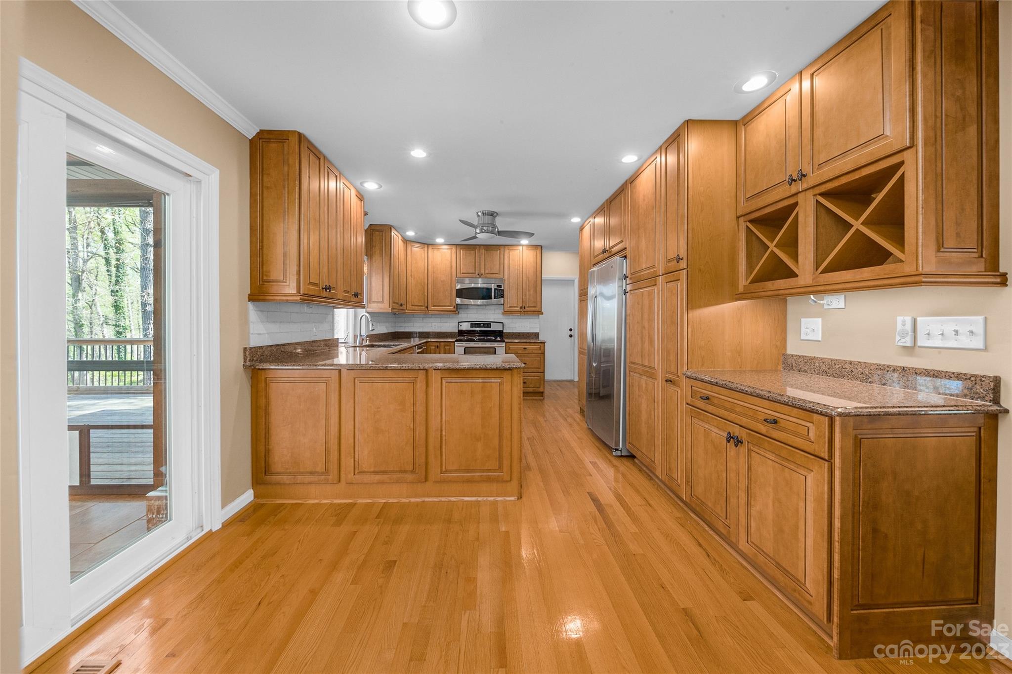 10700 Fairway Ridge Road Charlotte, NC 28277 - Photo 14 of 39 a kitchen with stainless steel appliances granite countertop a stove a sink and a refrigerator