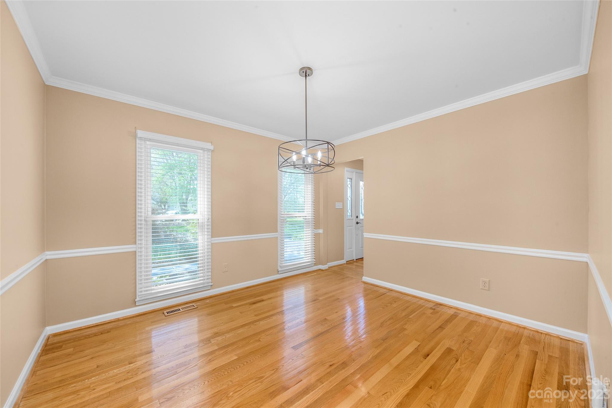10700 Fairway Ridge Road Charlotte, NC 28277 - Photo 17 of 39 a view of an empty room with wooden floor and a window