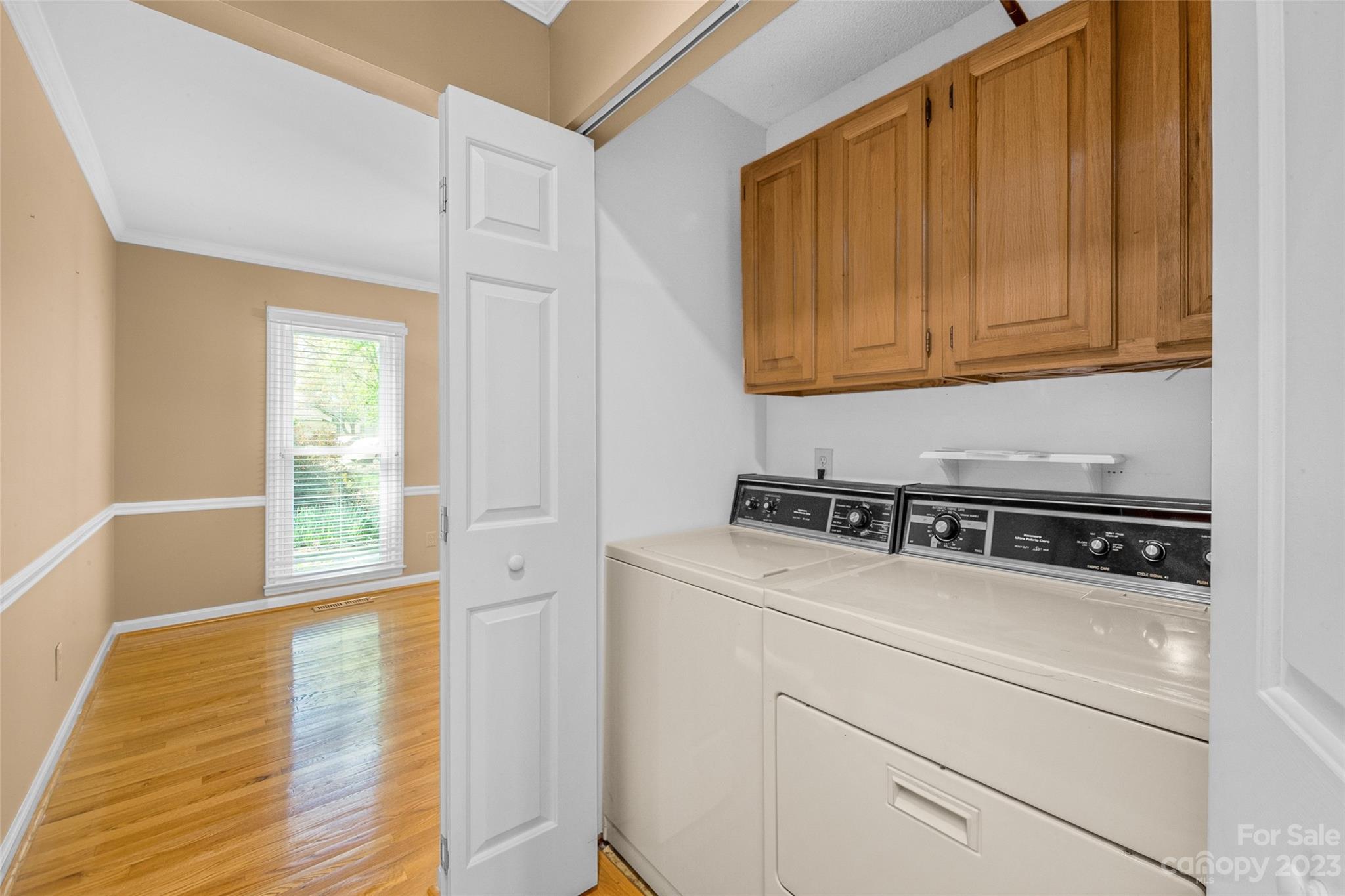 10700 Fairway Ridge Road Charlotte, NC 28277 - Photo 20 of 39 a utility room with wooden floor washer and dryer