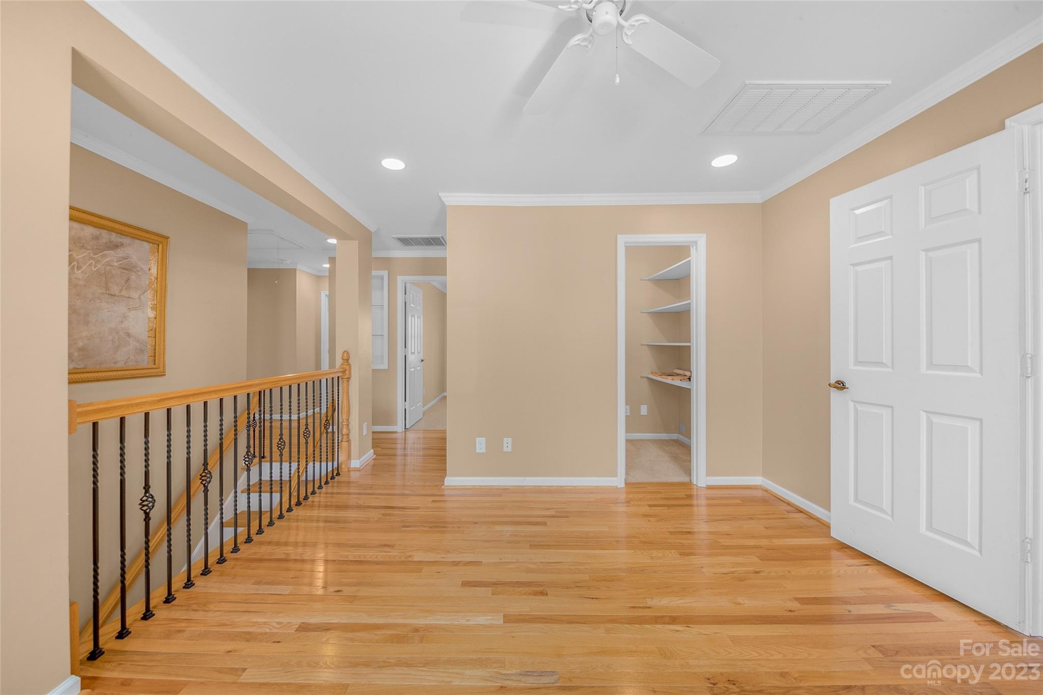 10700 Fairway Ridge Road Charlotte, NC 28277 - Photo 21 of 39 a view of a hallway with wooden floor and staircase